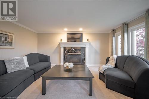 7789 Alpine Drive, Niagara Falls, ON - Indoor Photo Showing Living Room With Fireplace