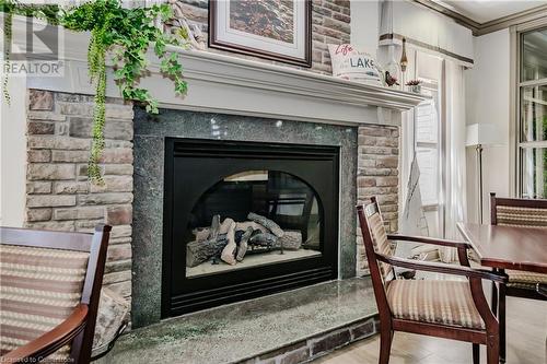 100 Burloak Drive Unit# 1214, Burlington, ON - Indoor Photo Showing Living Room With Fireplace