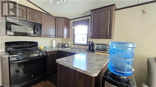 1501 Line 8 Road Unit# 228, Queenston, ON - Indoor Photo Showing Kitchen With Double Sink