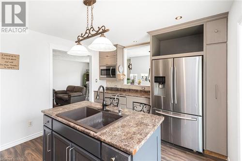 Kitchen with Island Seating for Two. - 47 Simson Avenue, Simcoe, ON - Indoor Photo Showing Kitchen With Double Sink