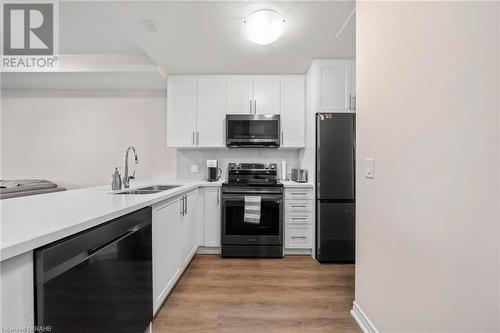 2750 King Street E Unit# 215, Hamilton, ON - Indoor Photo Showing Kitchen With Double Sink