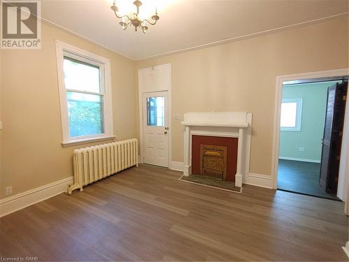 Living room/dining room - 15 Sherman Avenue S, Hamilton, ON - Indoor With Fireplace