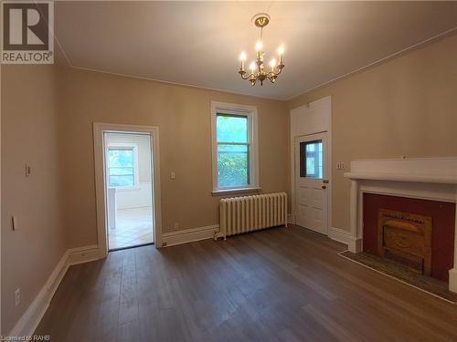 Living room/dining room - 15 Sherman Avenue S, Hamilton, ON - Indoor Photo Showing Other Room With Fireplace