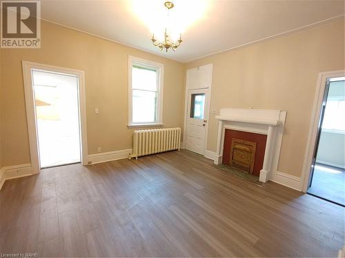 Living room/dining room - 15 Sherman Avenue S, Hamilton, ON - Indoor With Fireplace