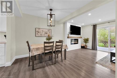 125 Livingston Avenue Unit# 16, Grimsby, ON - Indoor Photo Showing Dining Room With Fireplace