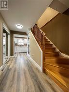 Entry hall view of kitchen and stairs - 