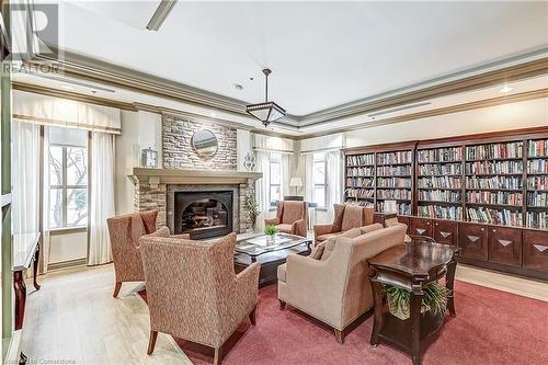 100 Burloak Drive Unit# 2405, Burlington, ON - Indoor Photo Showing Living Room With Fireplace