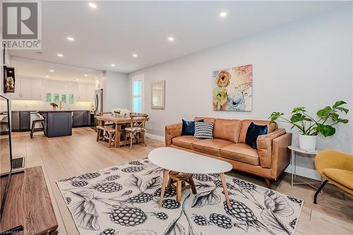 Luxury vinyl flooring - 41 East 32Nd Street, Hamilton, ON - Indoor Photo Showing Living Room