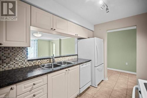 216 Plains Road W Unit# D307, Burlington, ON - Indoor Photo Showing Kitchen With Double Sink