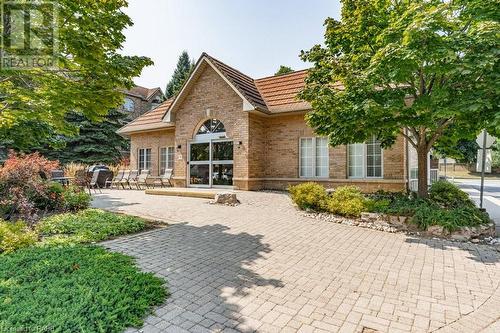 Outdoor barbecue and seating area! - 216 Plains Road W Unit# D307, Burlington, ON - Outdoor