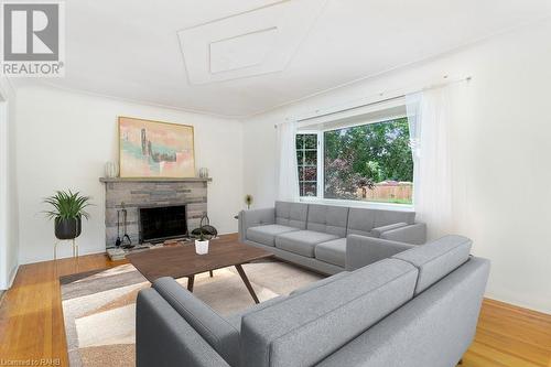 Virtually staged - 40 Robroy Avenue, Hamilton, ON - Indoor Photo Showing Living Room With Fireplace