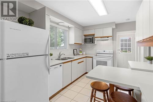 View of the pool - 1340 Humphreys Crescent, Burlington, ON - Indoor Photo Showing Kitchen With Double Sink