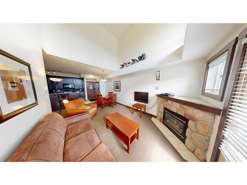 415 - 1500 Mcdonald Avenue, Fernie, BC - Indoor Photo Showing Living Room With Fireplace