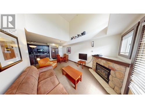 1500 Mcdonald  Avenue Unit# 415, Fernie, BC - Indoor Photo Showing Living Room With Fireplace