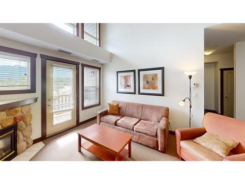 415 - 1500 Mcdonald Avenue, Fernie, BC - Indoor Photo Showing Living Room With Fireplace