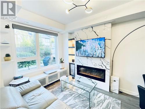 2530 Eglinton Avenue W Unit# 109, Mississauga, ON - Indoor Photo Showing Living Room With Fireplace