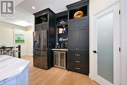 Pantry on right has power and roll-out drawers for coffee makers, toaster and microwave. - 