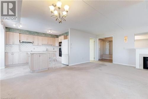 870 Upper Wentworth Street Unit# 202, Hamilton, ON - Indoor Photo Showing Kitchen With Fireplace