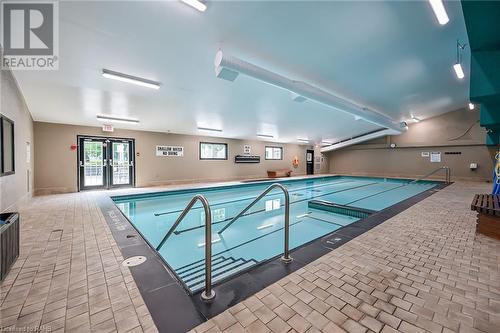 600 Silverbirch Boulevard Unit# 203, Mount Hope, ON - Indoor Photo Showing Other Room With In Ground Pool