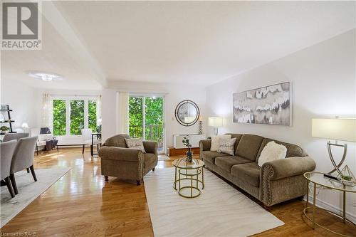 Spacious open floor plan with large windows for natural light - 3050 Pinemeadow Drive Unit# 56, Burlington, ON - Indoor Photo Showing Living Room