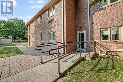 Accessible ramp located at the rear of building - 3050 Pinemeadow Drive Unit# 56, Burlington, ON - Outdoor With Deck Patio Veranda With Exterior