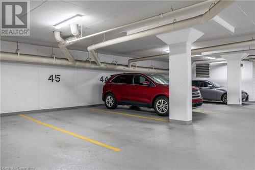 Owned Parking Spot - 85 Robinson Street Unit# 1002, Hamilton, ON - Indoor Photo Showing Garage