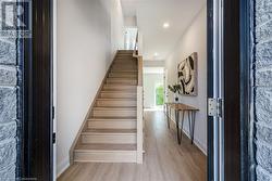 Foyer with hallway leading to additional living space - 