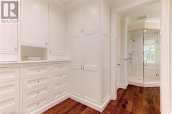 Meticulously designed floor to ceiling custom wardrobe cabinetry by Hallmark. - 