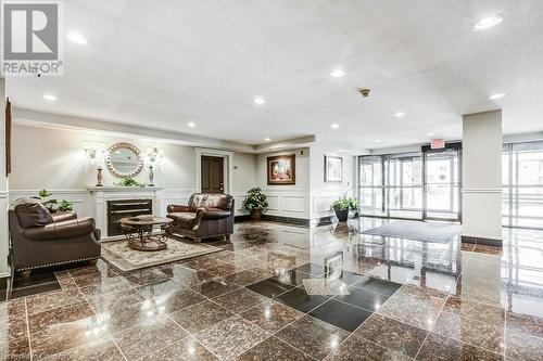 LOBBY - 1998 Ironstone Drive Unit# 409, Burlington, ON - Indoor With Fireplace