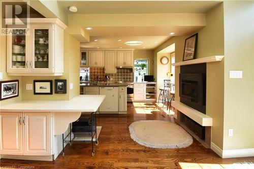 Entrance from Family room to Kitchen - 24 John Street E, Waterdown, ON - Indoor With Fireplace