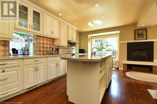 Kitchen with center island and Gas Fire Place - 24 John Street E, Waterdown, ON - Indoor Photo Showing Kitchen With Upgraded Kitchen