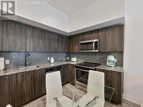 542 - 20 Shore Breeze Drive, Toronto, ON - Indoor Photo Showing Kitchen With Upgraded Kitchen