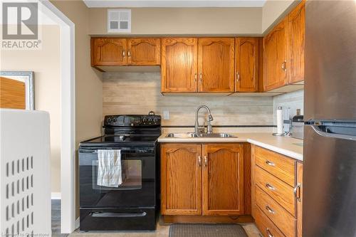 200 Limeridge Road W Unit# 604, Hamilton, ON - Indoor Photo Showing Kitchen With Double Sink