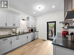 Kitchen on main-floor: new exterior door (2018) leading to backyard - 