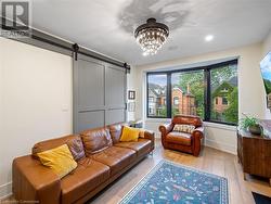 Living room in upper unit (2nd flr). Note the large bay window! - 