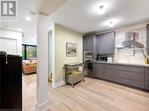 Kitchen in upper unit (2nd flr). Built-in oven with warming drawer, built-in stove top with hood vent and pot-filler! - 213 Caroline Street S, Hamilton, ON 