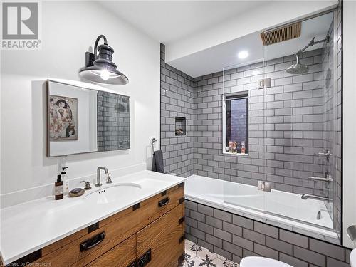 STUNNING 4-piece bathroom in upper unit (2nd flr). High-end fixtures, tub, and toilet. - 213 Caroline Street S, Hamilton, ON 