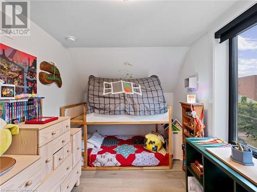 Bedroom #2 has a large window making it a bright space (upper unit - 3rd flr). Not pictured is the large closet! - 213 Caroline Street S, Hamilton, ON 