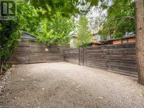 2 parking spaces at rear of property (accessed via alley) and has gate that opens into the backyard - 213 Caroline Street S, Hamilton, ON 