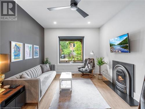 Living room on main-floor. Note the gas fireplace! - 213 Caroline Street S, Hamilton, ON 