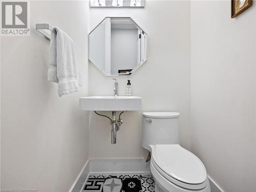 2-pc powder room on main-floor - 213 Caroline Street S, Hamilton, ON - Indoor Photo Showing Bathroom