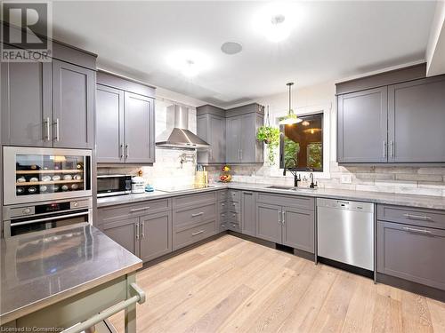 Kitchen in upper unit (2nd flr). Note the built-in wine fridge! - 213 Caroline Street S, Hamilton, ON - Indoor Photo Showing Kitchen With Upgraded Kitchen