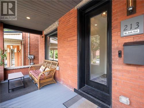 Cozy front verandah with put lighting - 213 Caroline Street S, Hamilton, ON - Outdoor With Exterior