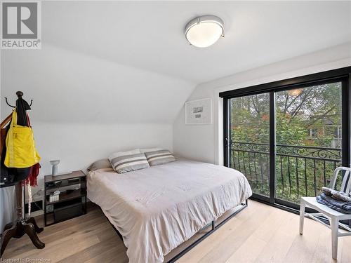 Bedroom #1 with juliette balcony overlooking backyard (upper unit - 3rd flr) - 213 Caroline Street S, Hamilton, ON - Indoor Photo Showing Bedroom