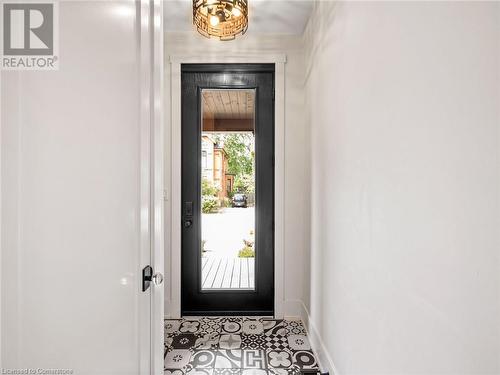 Ciot patterned tile and new exterior door (2018) - 213 Caroline Street S, Hamilton, ON - Indoor Photo Showing Other Room