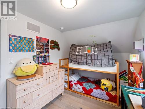 Bedroom #2 has a large window making it a bright space (upper unit - 3rd flr). Not pictured is the large closet! - 213 Caroline Street S, Hamilton, ON - Indoor Photo Showing Bedroom