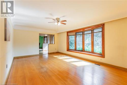 Living Room with Original Hardwood Flooring - 405 Inverness Avenue E, Hamilton, ON - Indoor Photo Showing Other Room