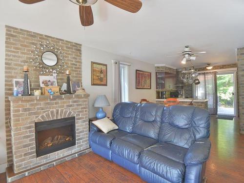 Living room - 174 Rue Du Châtelet, Saint-Colomban, QC - Indoor Photo Showing Living Room With Fireplace