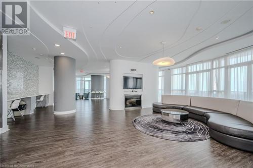 Lounge - 60 Absolute Avenue Unit# 3004, Mississauga, ON - Indoor Photo Showing Living Room With Fireplace