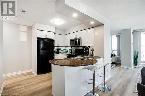 4090 Living Arts Drive Unit# 2308, Mississauga, ON - Indoor Photo Showing Kitchen With Double Sink